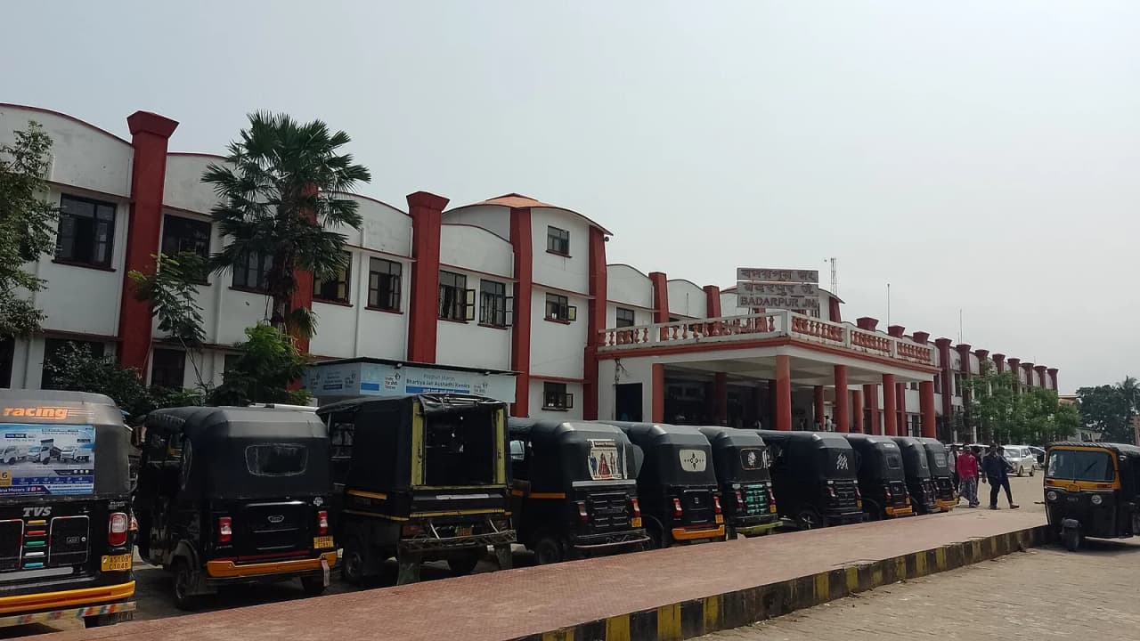 Front view of a railway station named Badarpur Junction